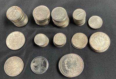 a bunch of coins sitting on top of a table next to each other