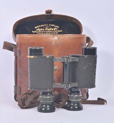 a brown bag with a pair of binoculars in it