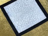 a picture of a picture of a square on a gold surface