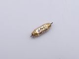 a small piece of metal with a gold and blue design on it