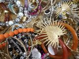 a pile of jewelry that is on a table