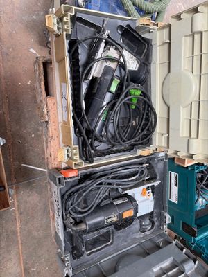 a tool case with tools in it sitting on the floor