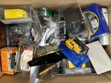 a cardboard box filled with assorted electronic devices
