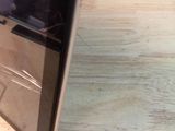 a laptop computer sitting on top of a wooden table