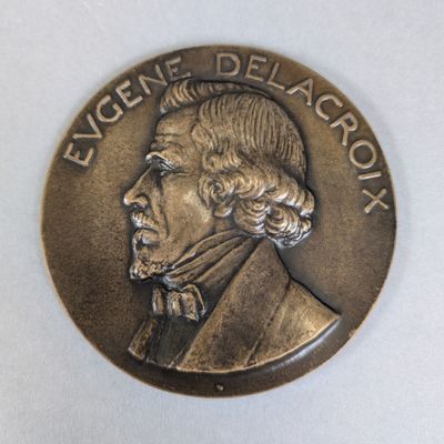 une image représentant une pièce de monnaie sur laquelle figure le portrait d'un homme