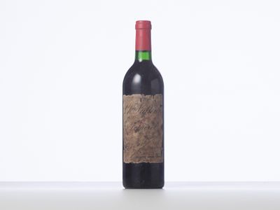 a bottle of wine that is sitting on a table