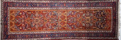 an image of a large oriental rug on display in a room