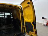 a yellow van with its doors open in a garage