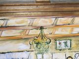 a painting on the wall of a room with a chandelier