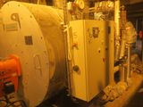 a large boiler in the middle of a room