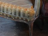 a chair that is sitting in the corner of a room