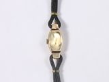 an image of a wrist watch with a gold face and black leather strap