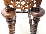 a small wooden table with a wooden top and two wooden legs