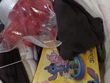 a bag full of clothes and a book in it