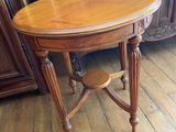 a wooden table with a wooden top on a hard wood floor