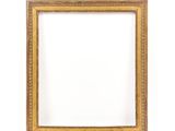 an old picture frame on a white wall with a white background