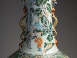 a vase with a design on it sitting on a table