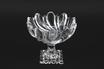 black and white photograph of a glass bowl with spoons in it