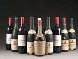 several bottles of wine are lined up in a row on a table