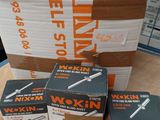 several boxes of tools are stacked on top of each other on a table