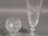 two wine glasses sitting next to each other on a table