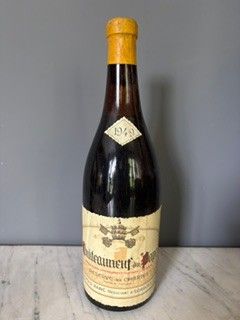 a bottle of wine that is sitting on a table