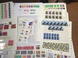 a lot of stamps on a table with a lot of them