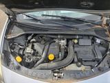 the engine of a car with its hood open and the hood down