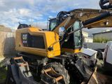 a picture of a construction vehicle that is parked in a yard