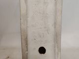 a white vase with a hole in it on a table