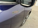 a close up of a car ' s side mirror with a sticker on it