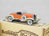 an orange and white model of a car on top of a box
