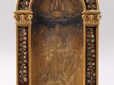 an image of a gold - plated statue of a man and a woman on a cross