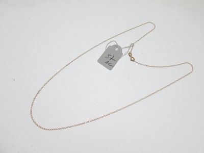 a close up of a silver necklace with a tag on it