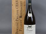 the bottle of wine is next to a wooden box