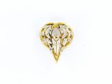 une image d'une broche en or et diamants