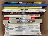 many books stacked on top of each other in a box