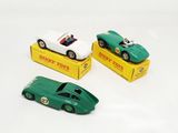 three toy cars that are sitting on top of a box
