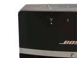 the bose bluetooth speaker is sitting on top of a table
