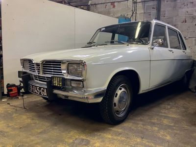 a white car that is parked in a garage
