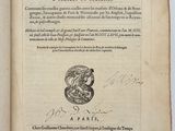 an open book with a drawing of a dragon on it