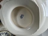 a white porcelain bowl with a blue and white design on it