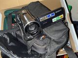 a camera sitting in a box with other items in it