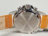 a close up of a watch on a white surface
