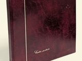 a close up of a book with a red cover on a white background
