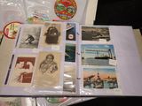 a pile of old postcards sitting on top of a table