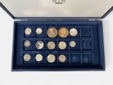 a box with a lot of coins inside of it