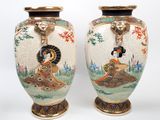 pair of asian vases with a woman and a man on a boat