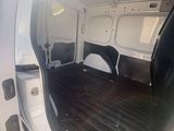 a white van with the door open on a sunny day