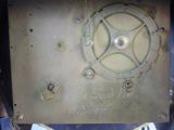 a close up of a metal clock with numbers on it